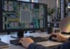 Cadence Maestro AI Models Bring Specialized Agents to Chip Design: What Engineers Should Know Conceptual semiconductor design workstation with a microchip and detailed electronic design layouts illustrating AI-assisted chip engineering.